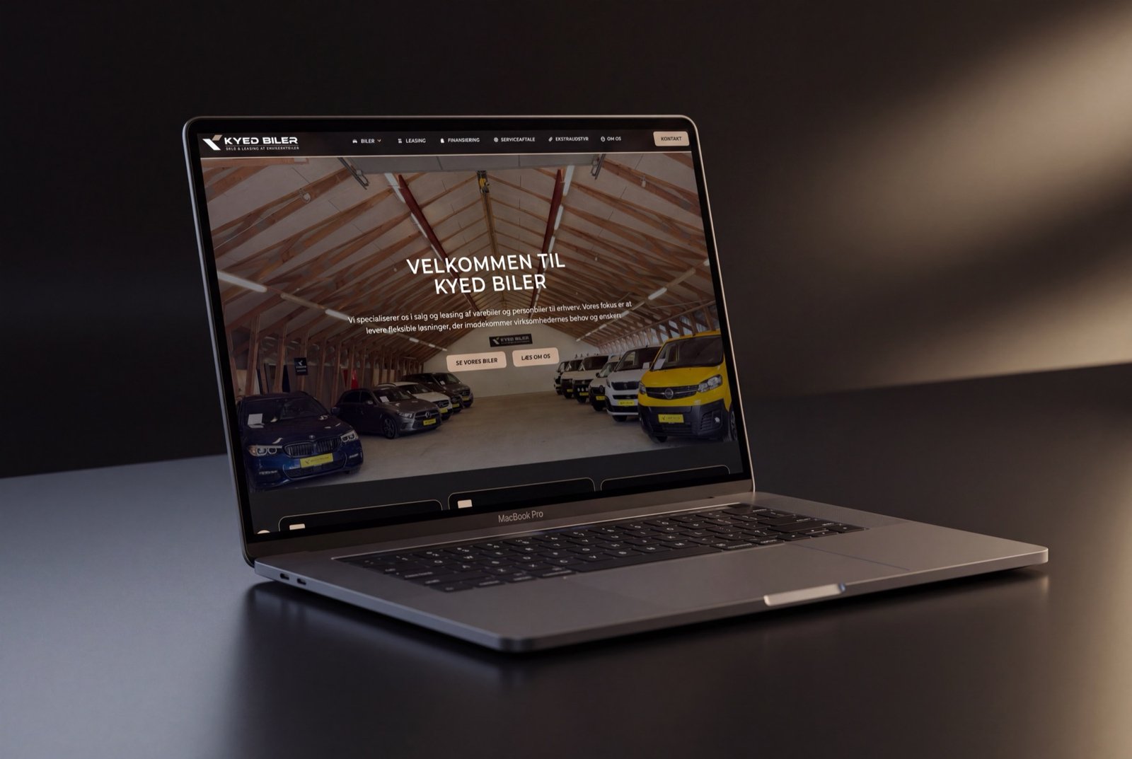 Kyed Biler – forside vist på MacBook